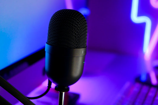 a microphone sitting in front of a laptop computer